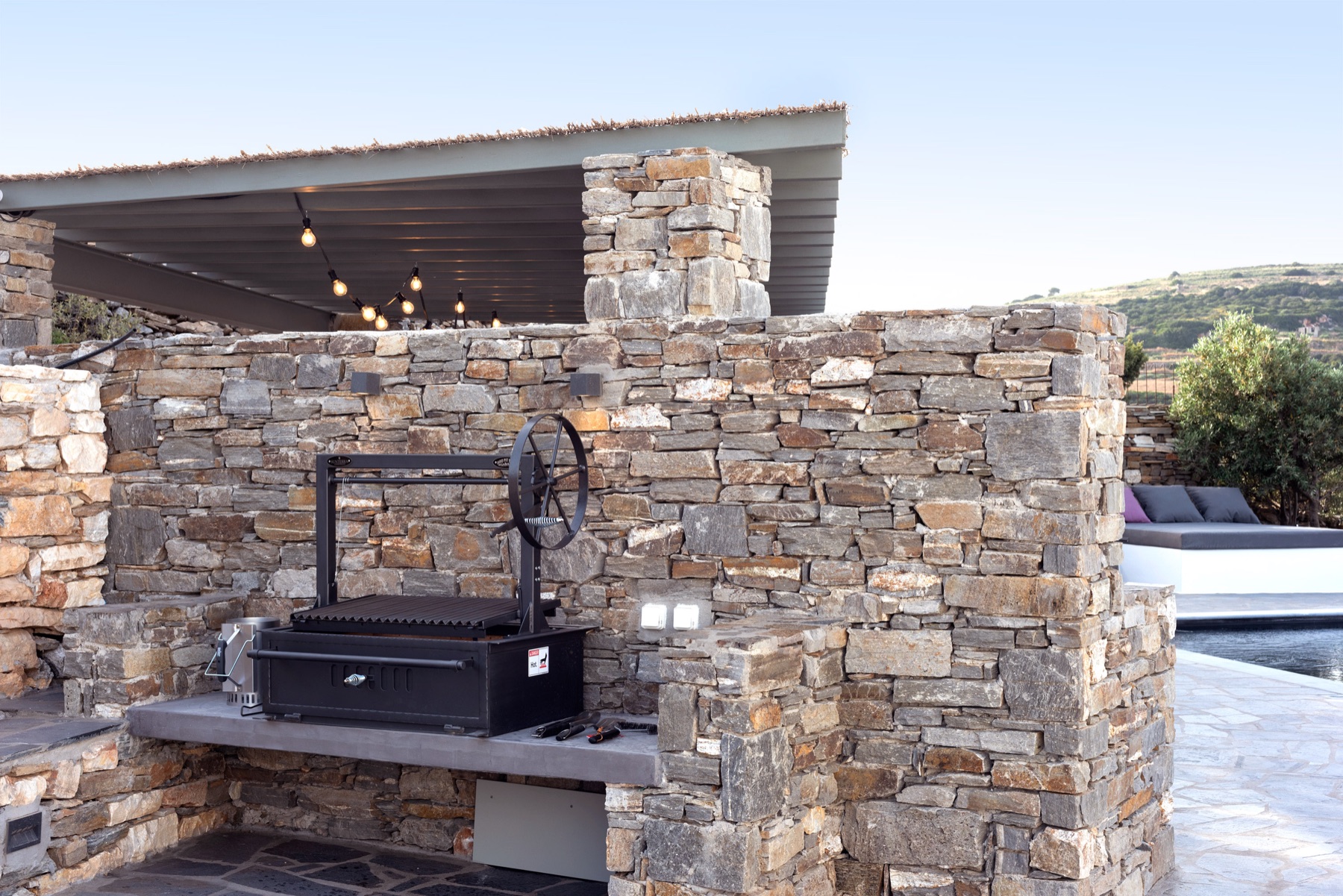 The BBQ area beside the pool